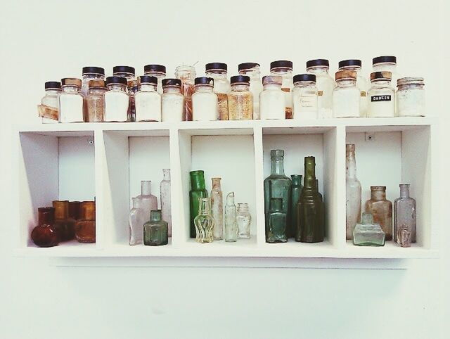Rows of objects on shelf