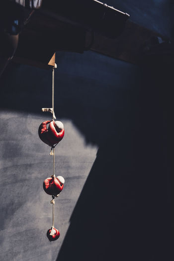 Close-up of red objects hanging against wall