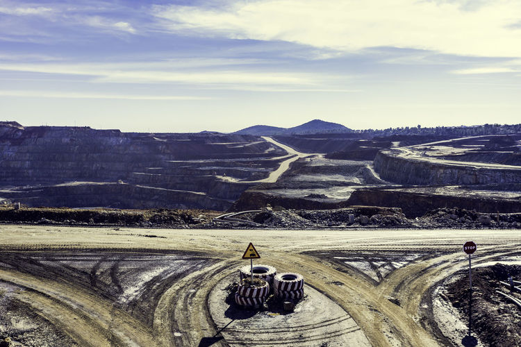 Aerial view of the riotinto opencast mining quarry with blue sky and clouds