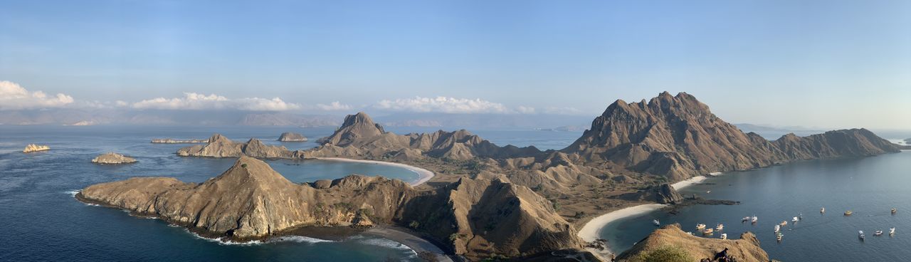 Panoramic view of sea and mountains against sky on padar island komodo 