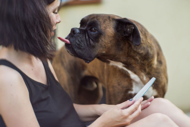 Boxer teasing to woman sitting at home