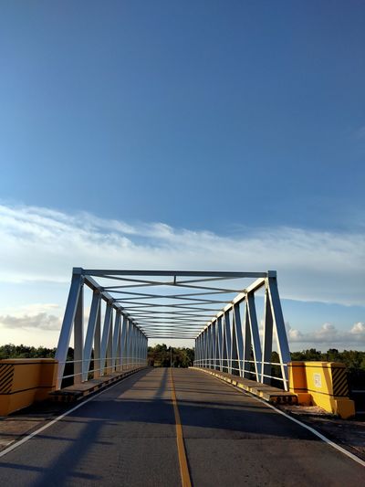 Empty bridge against sky