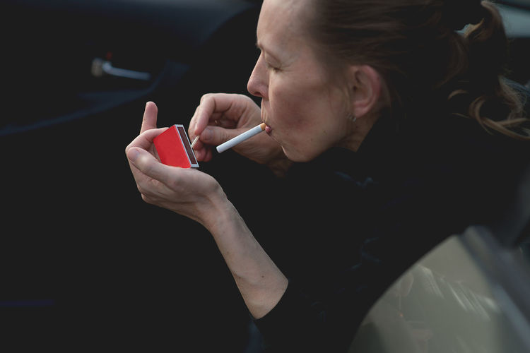 Close-up of woman smoking cigarette