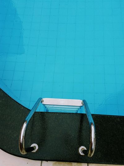 High angle view of the handles of a swimming pool ladder