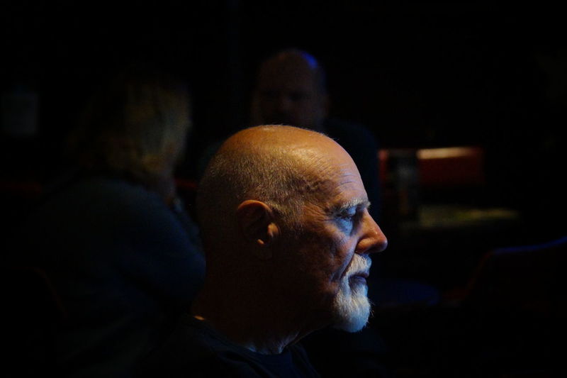 Close-up of senior man in darkroom
