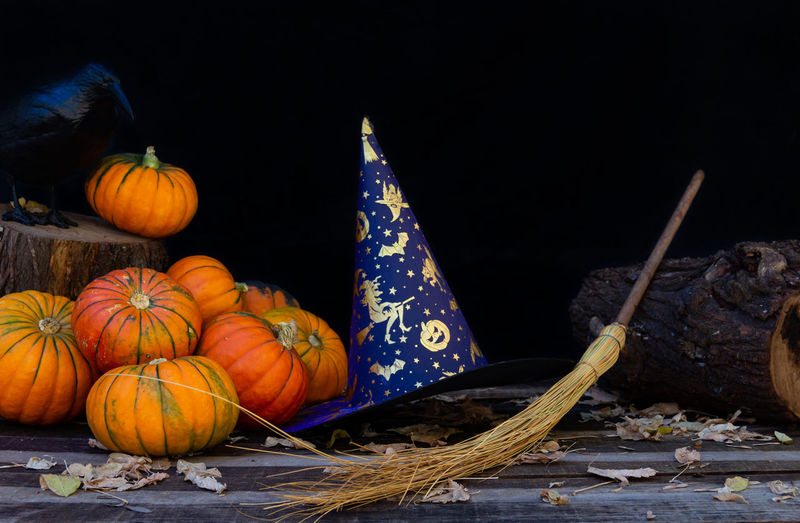 High angle view of pumpkins on table against black background