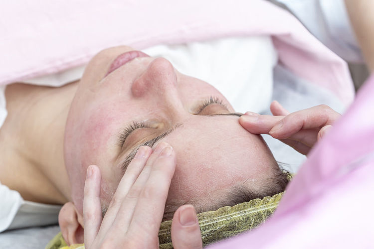 Woman getting face massage