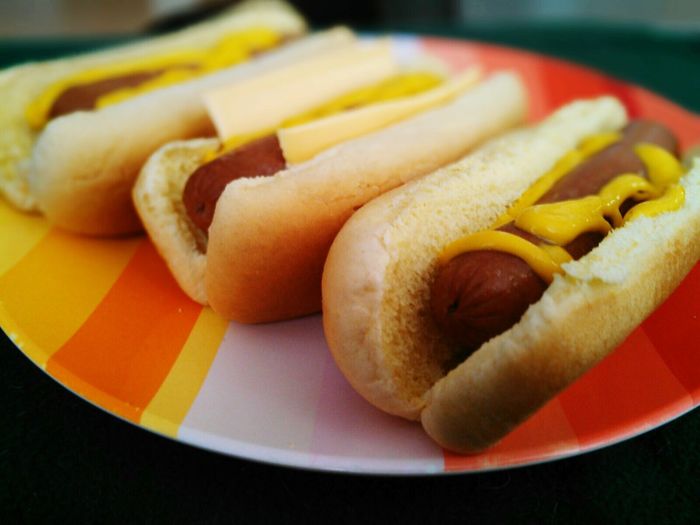 Hot dogs served in plate on table