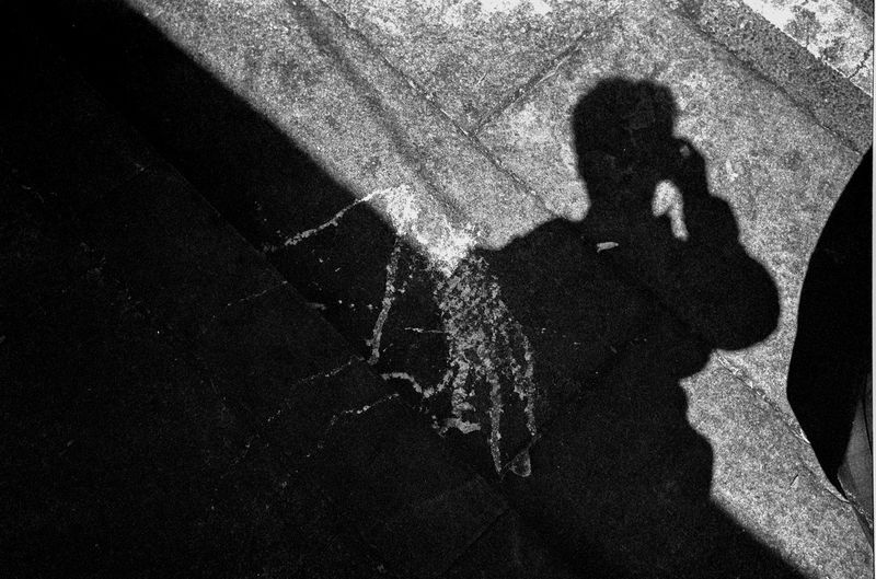 High angle view of person shadow on street