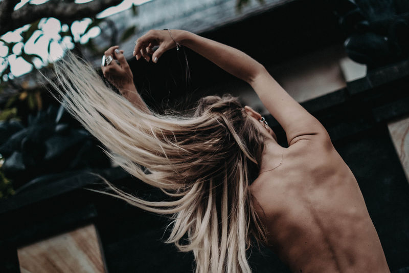 High angle view of naked woman with tousled hairs