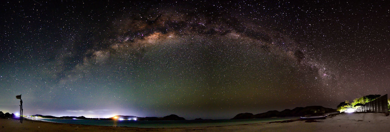 Low angle view of illuminated star field against sky at night