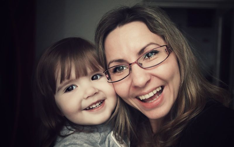 Close-up of happy woman with her daughter