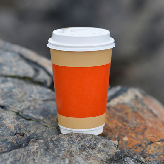 Close-up of coffee cup on rock