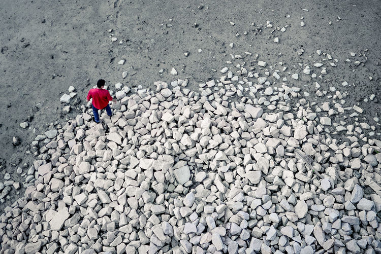 High angle view of man standing on rocks