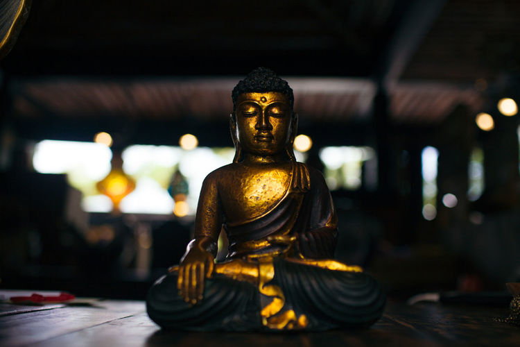 Meditating buddha statue made of gold