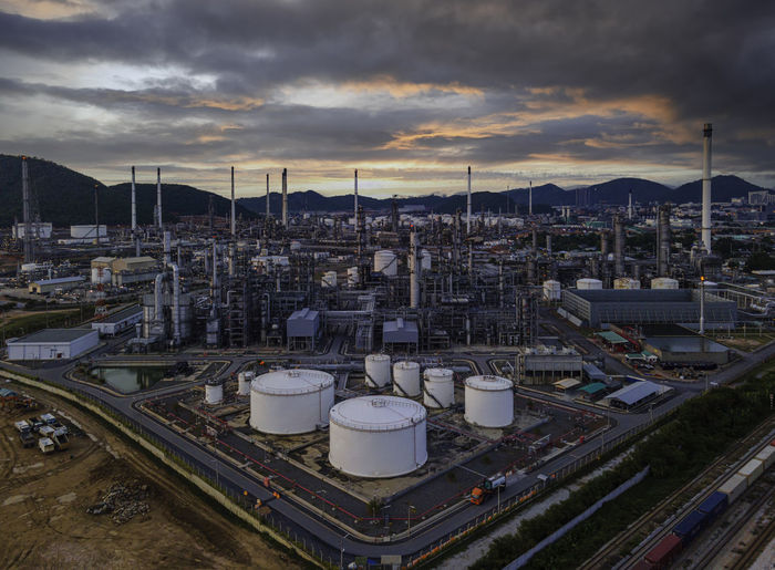 High angle view of factory against sky during sunset