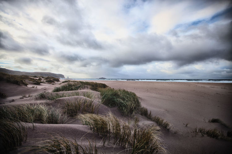 Scenic view of beach against sky