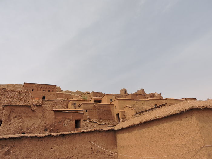 Low angle view of old ruin building against sky
