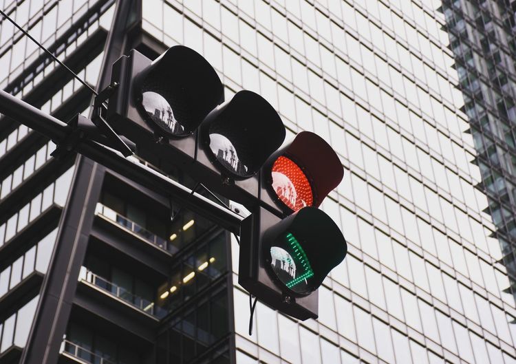 Low angle view of traffic light against building