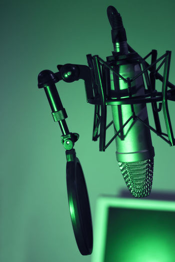 Close-up of microphone against blue background