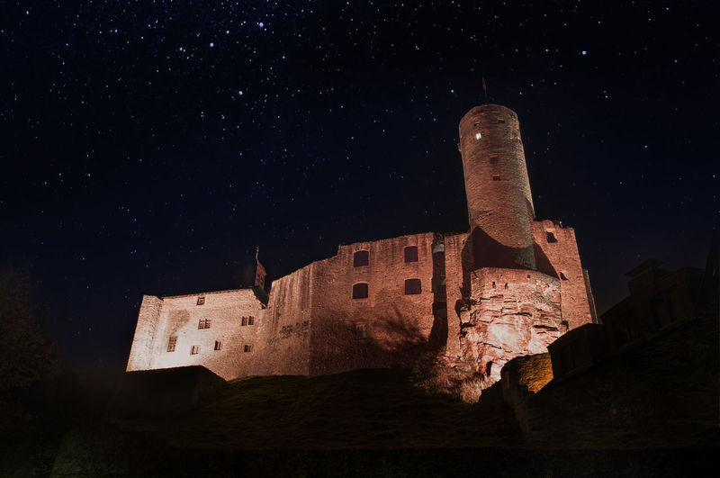 Low angle view of old ruins against sky at night