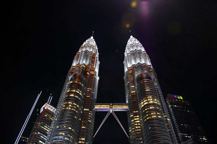 Spires of the petronas twin towers with cloudy background during a rainy day