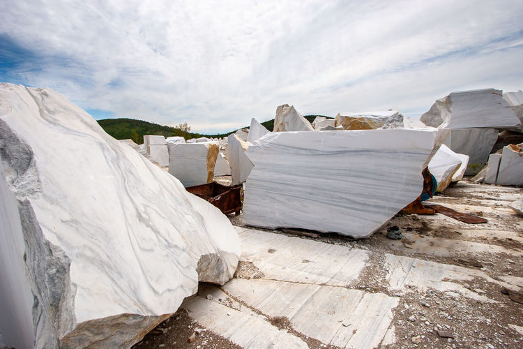 Large white marble blocks in an old abandoned quarry. beautiful marble texture.