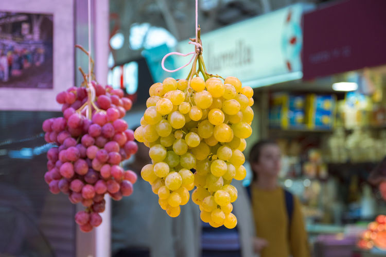 Close-up of fruits hanging outdoors