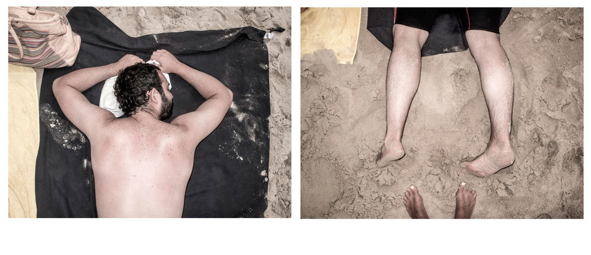Man lying on sand