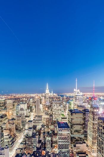 Cityscape against blue sky