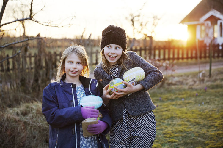 Girls holding easter eggs