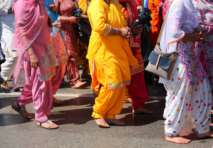 Many sikh women on the road with colorful clothes