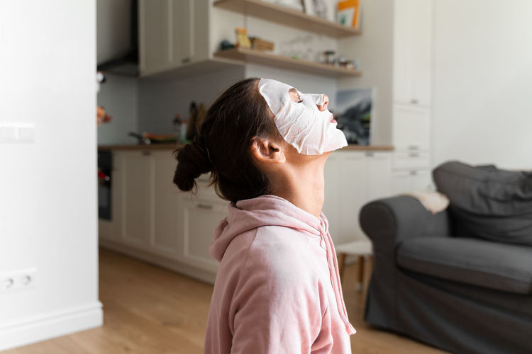 Side view of girl at home
