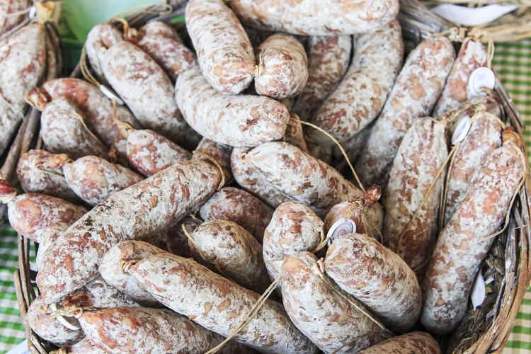 High angle view of salami in basket at market for sale