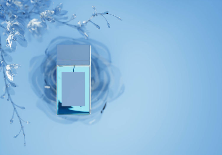 Close-up of smart phone against blue background