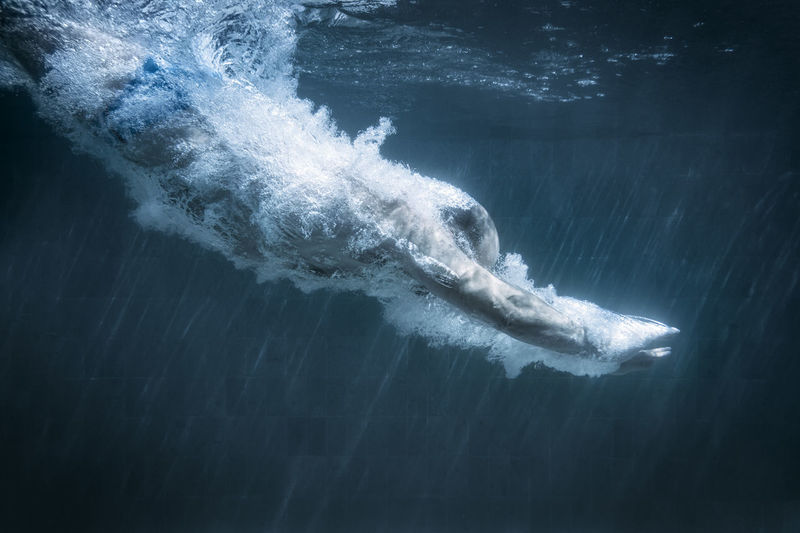 Side view of person diving in water