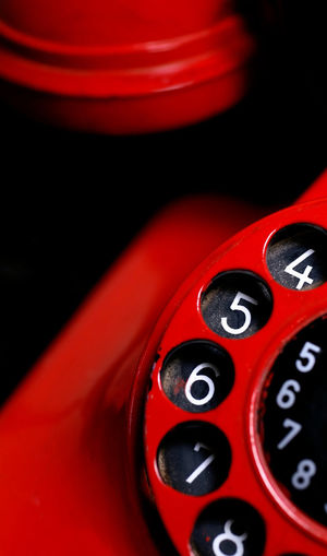 Close-up of red rotary phone