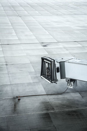 High angle view of passenger boarding bridge at airport