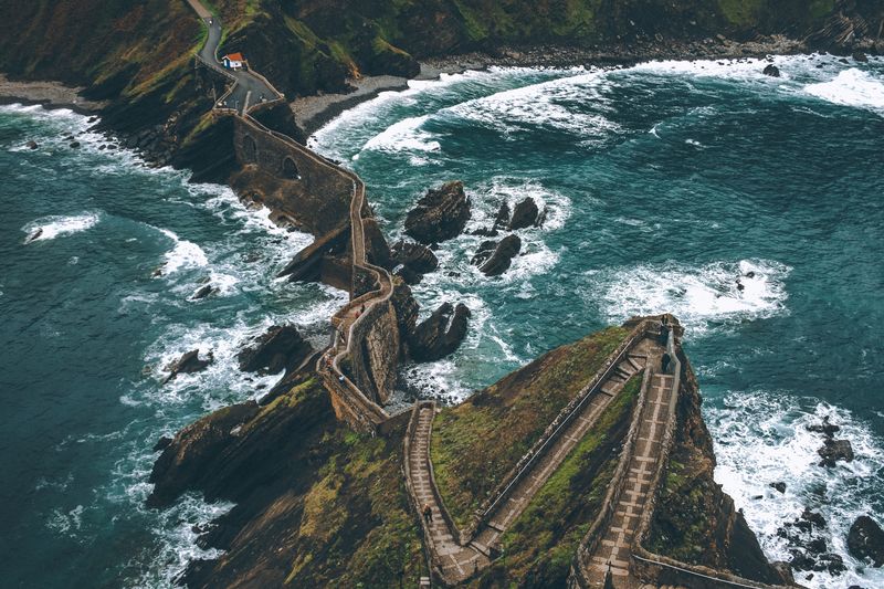 High angle view of walkway on rock formation amidst sea