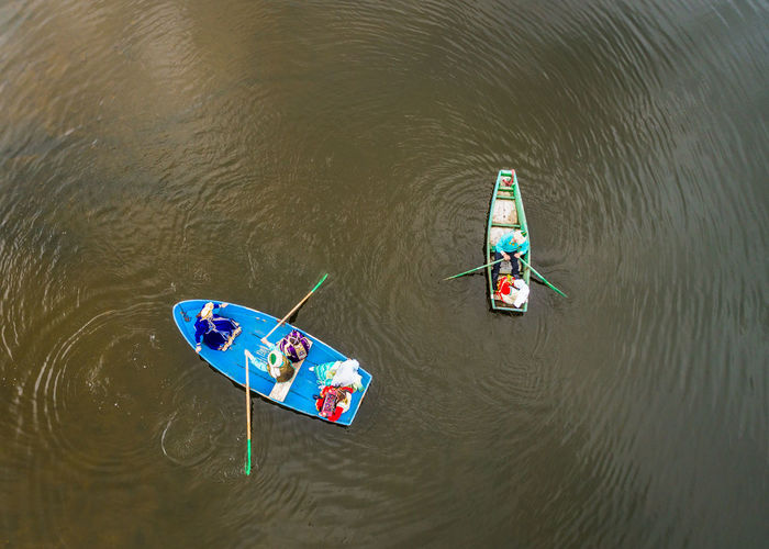 High angle view of people on boat in river