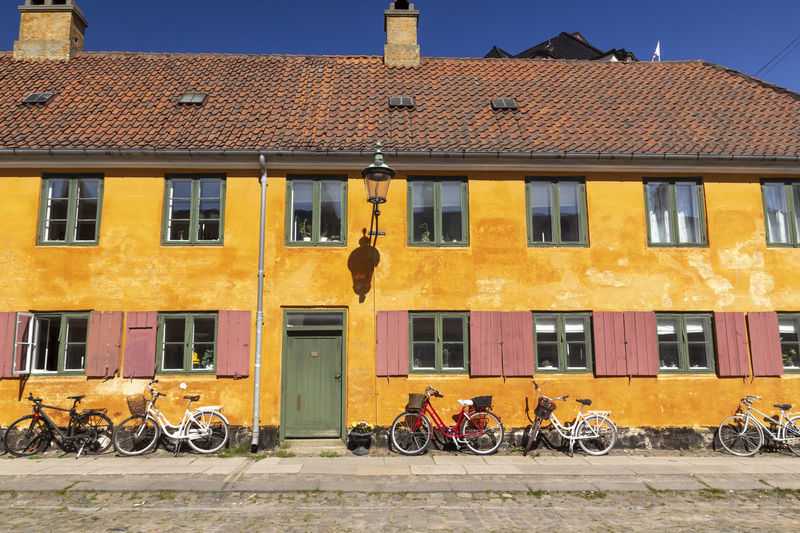 Bicycles on street against buildings