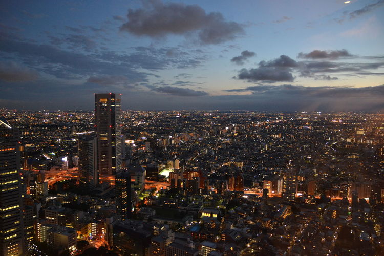 High angle view of illuminated city scope