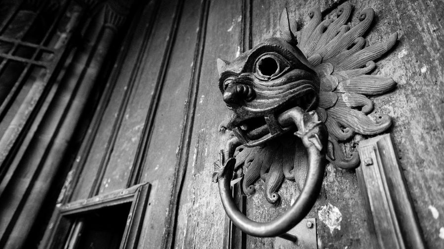 Low angle view of old-fashioned door knocker