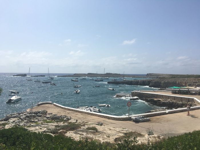 A small village port of binebeca in menorca on a sunny day