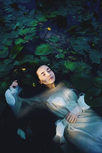 Low angle view of young woman swimming in lake