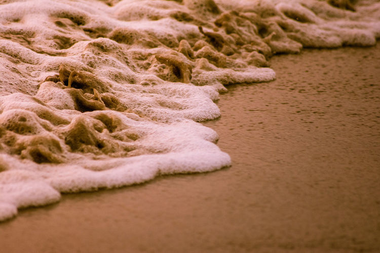 Close-up of sand at beach