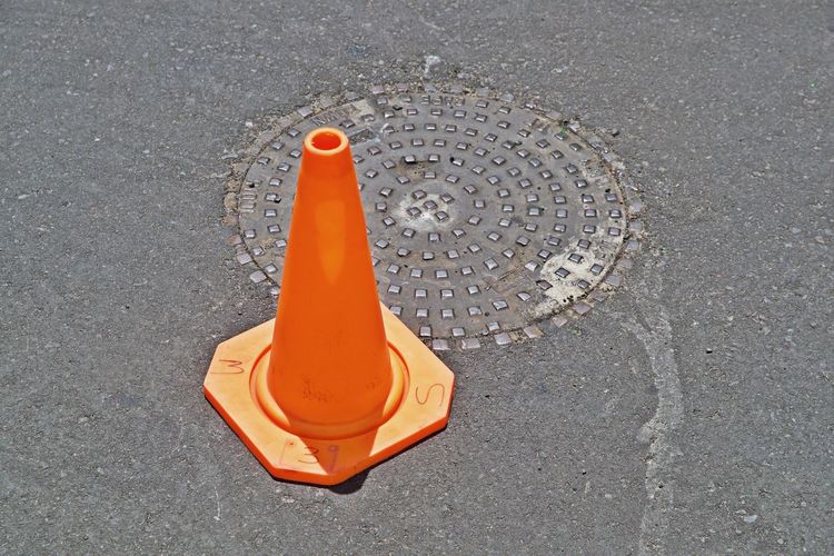 High angle view of orange flag on road