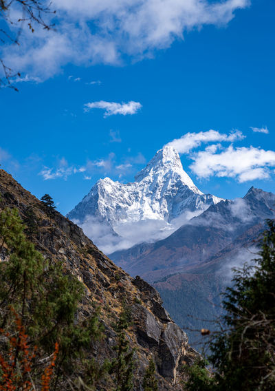 Scenic view of snowcapped mountains against sky