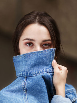 Portrait of woman covering face