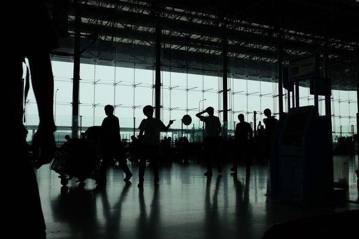 Group of silhouette people at airport